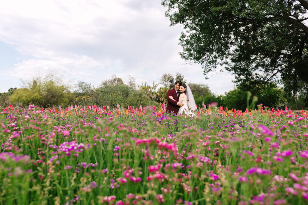 planning your Los Angeles Wedding, bride and groom in field of flowers