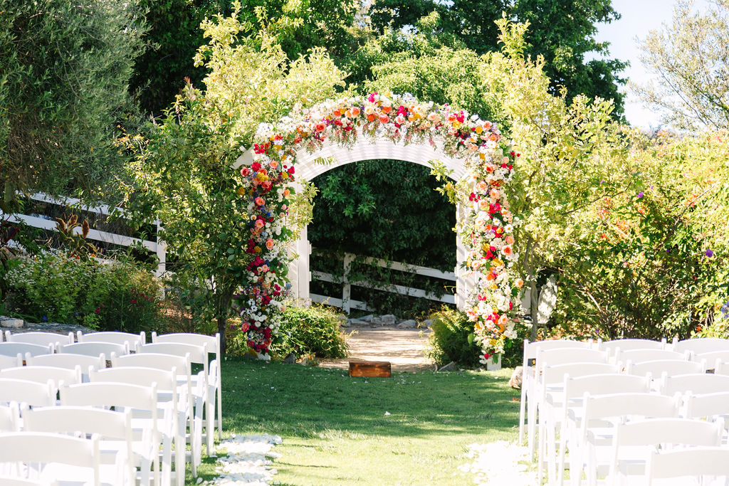 madonna inn wedding photographer, garden ceremony with flower arch