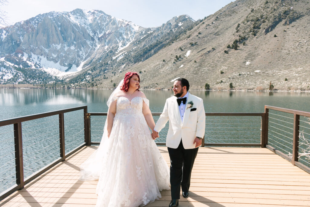 Mammoth Lakes Wedding, bride and groom walking on a dock at Convict Lake