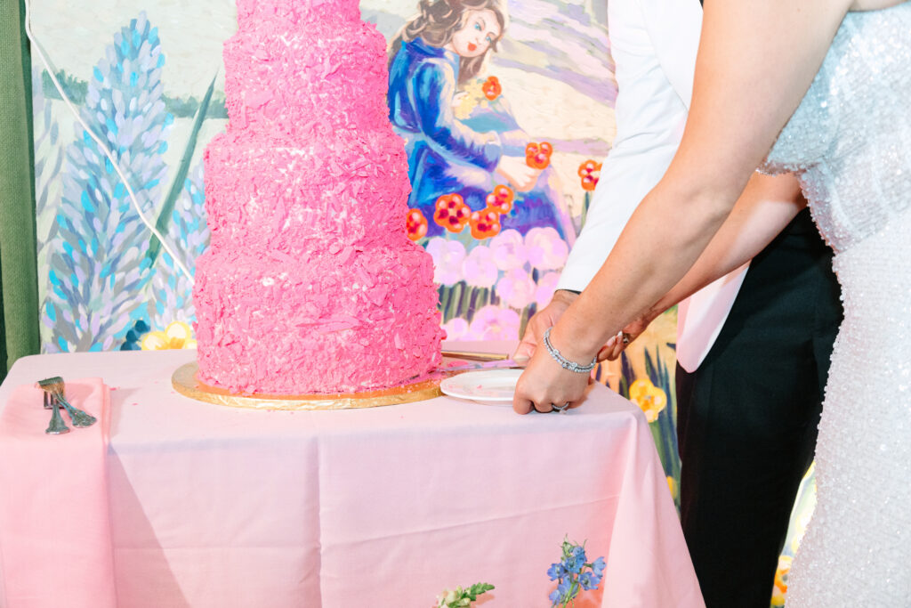 Madonna Inn Wedding bride and groom cutting their pink wedding cake.