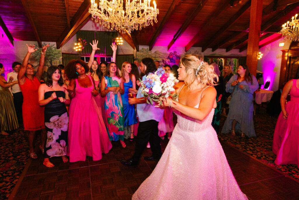 Madonna Inn Wedding Bride bouquet toss during the reception