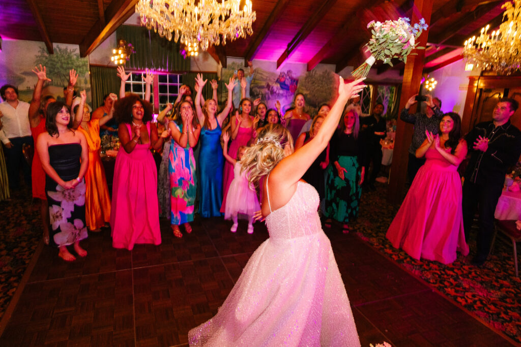 Madonna Inn Wedding Bride bouquet toss during the reception